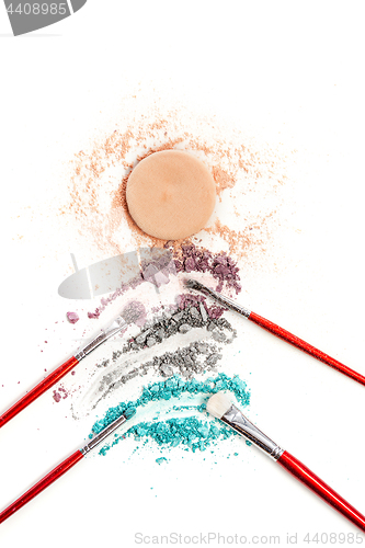 Image of The colored eyeshadow crushed on white close up for background