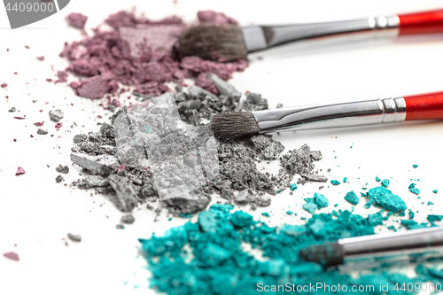 Image of The colored eyeshadow crushed on white close up for background