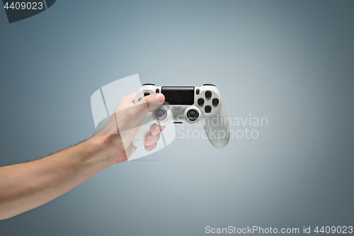 Image of Male Hands Holding Gamepad