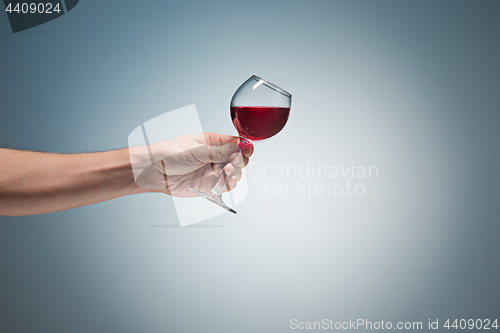 Image of The one wine glass against gray