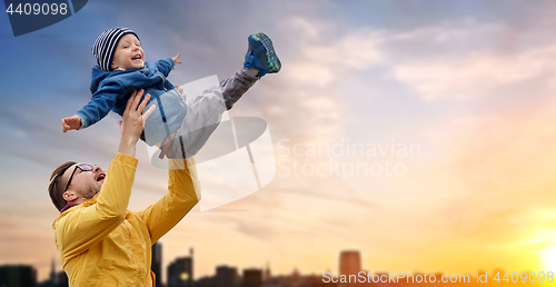 Image of father with son playing and having fun outdoors