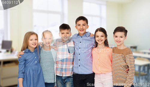 Image of happy students hugging at school