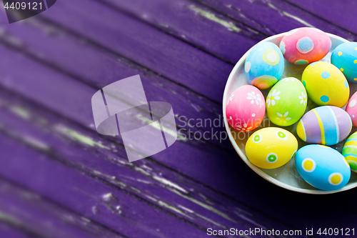 Image of close up of colored easter eggs on plate