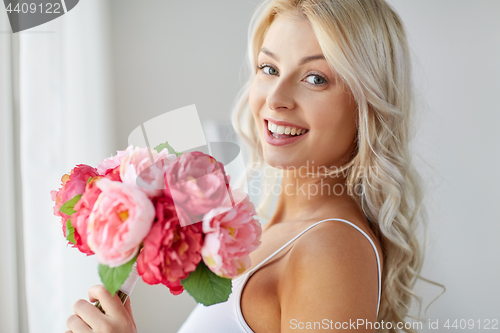 Image of close up of woman with bunch of flowers