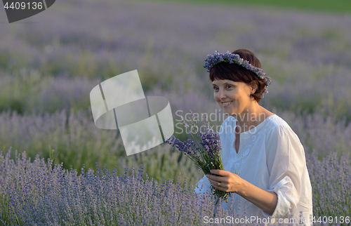 Image of Beautiful woman holding lavender 