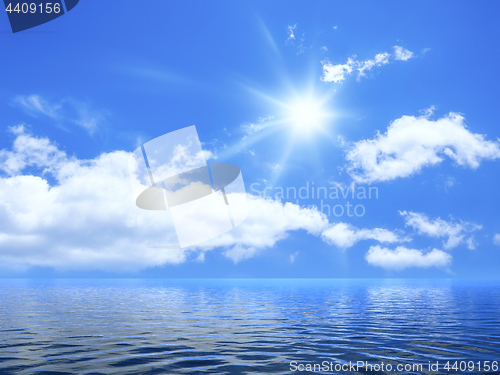 Image of blue sky with some clouds and the sun over the ocean