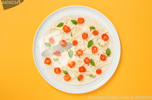 Image of Vegetarian tortilla on bright yellow background