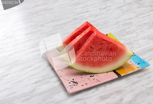 Image of Slices of watermelon on a ceramic plate