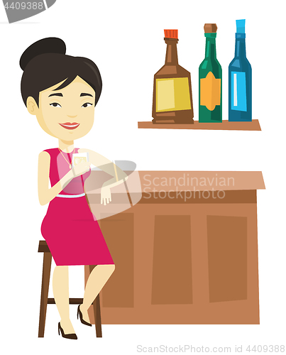 Image of Smiling woman sitting at the bar counter.
