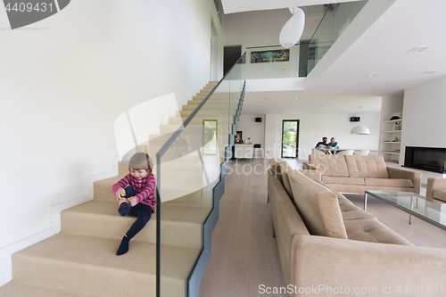 Image of family with little girl enjoys in the modern living room