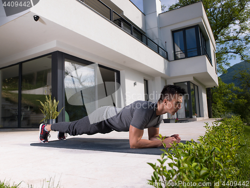 Image of man doing morning yoga exercises