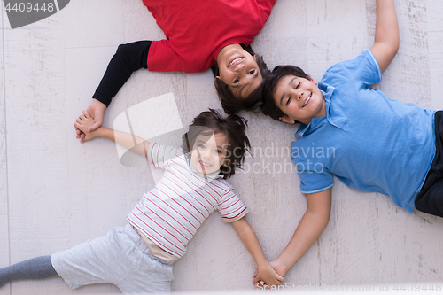 Image of young boys having fun on the floor