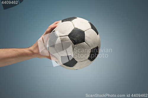 Image of Hands holding soccer ball