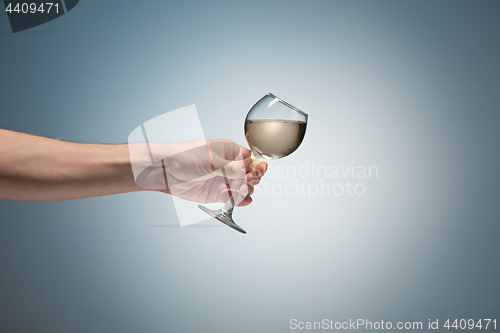 Image of Close-up view of white wine glass