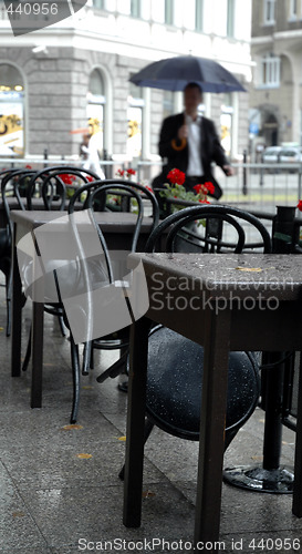 Image of rainy street cafe