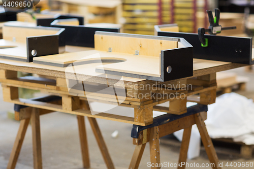 Image of furniture items on workbench at workshop