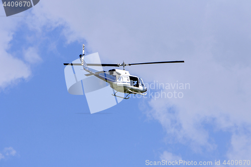 Image of Blue helicopter flight in the sky