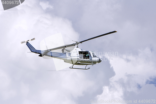 Image of Blue helicopter flight in the sky