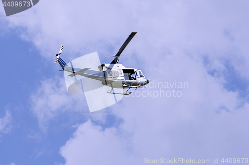 Image of Blue helicopter flight in the sky