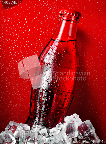 Image of Cola on a red background