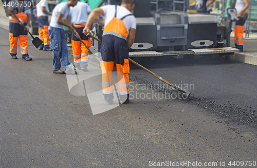 Image of Construction workers on asphalting and road repair