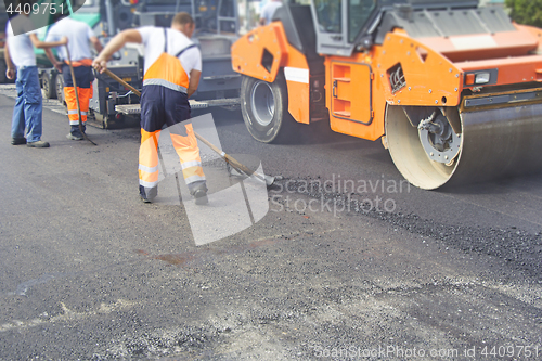 Image of Construction workers on asphalting and road repair