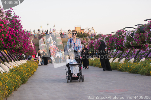 Image of mother and daughter in flower garden