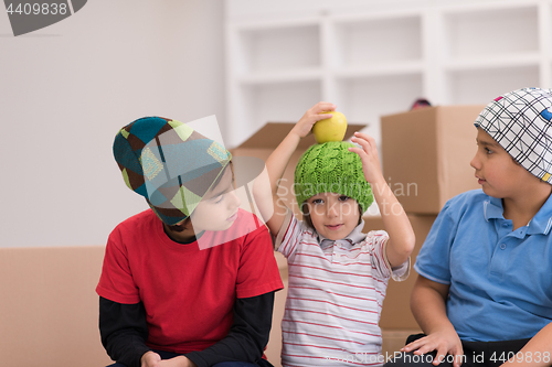 Image of boys with cardboard boxes around them