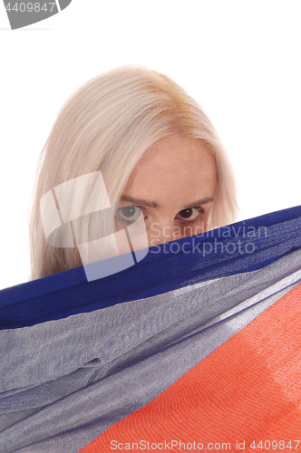 Image of Woman hiding behind soma fabric
