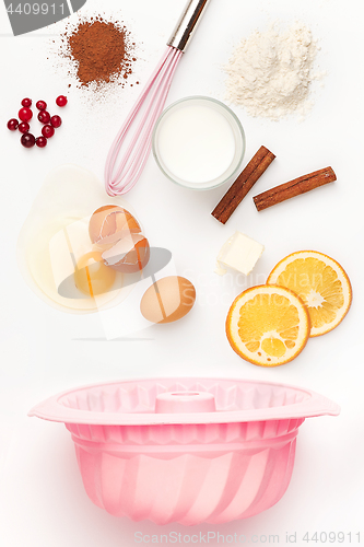 Image of The falling ingredients of pie or cake on white background