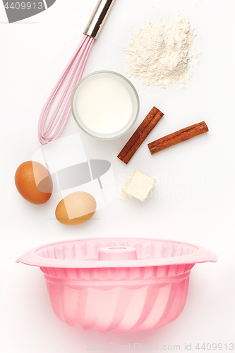 Image of The falling ingredients of pie or cake on white background