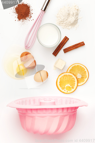 Image of The falling ingredients of pie or cake on white background