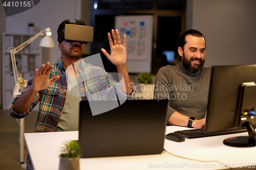 Image of creative man in virtual reality headset at office