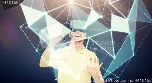 Image of happy man in virtual reality headset or 3d glasses