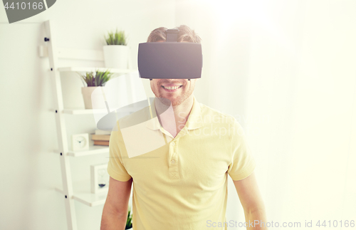 Image of young man in virtual reality headset or 3d glasses