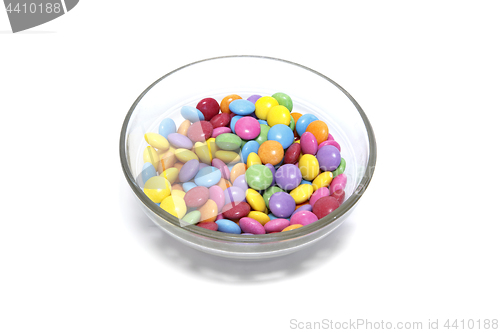 Image of Bright colorful candy in glass bowl on white background