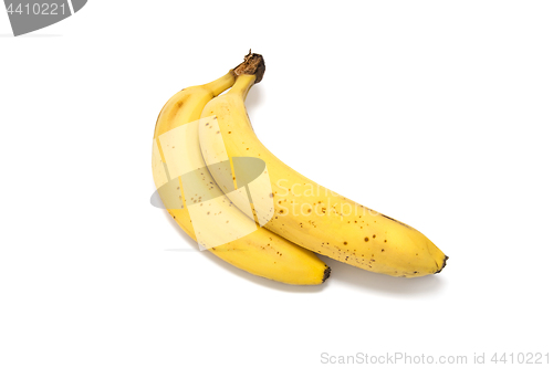 Image of Ripe yellow bananas on white background