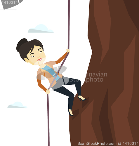 Image of Business woman climbing on the mountain.