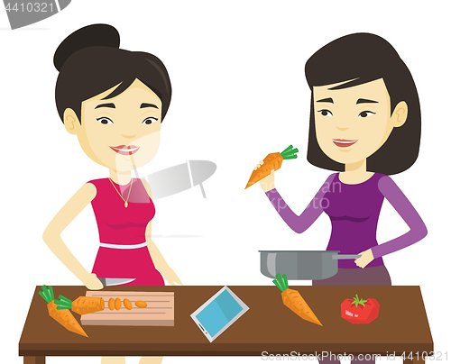 Image of Women cooking healthy vegetable meal.