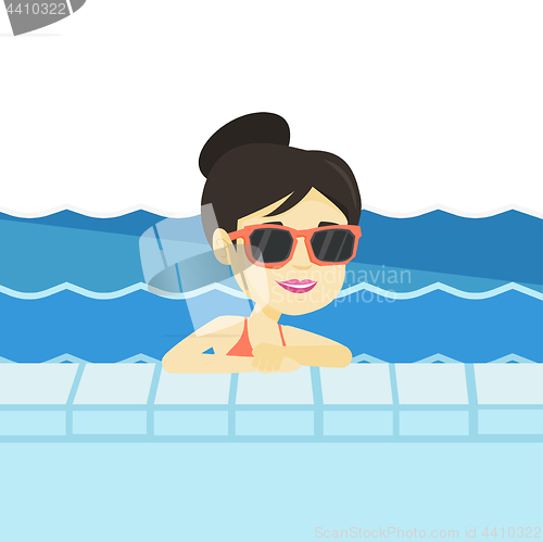 Image of Smiling young woman in swimming pool.