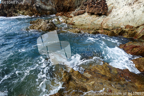 Image of Waves on stone beach
