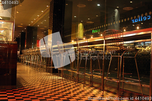 Image of Chairs in row in bar