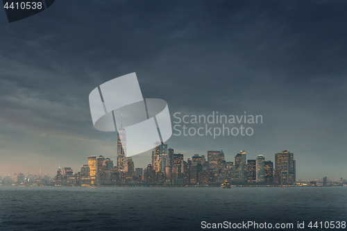 Image of Panoramic view of storm over Lower Manhattan from Ellis Island at dusk, New York City.