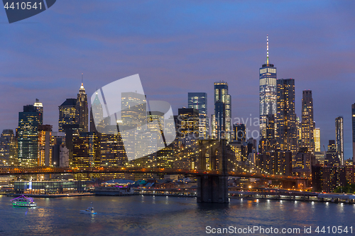 Image of Brooklyn Bridge and Lower Manhattan skyline at night, New York city, USA.