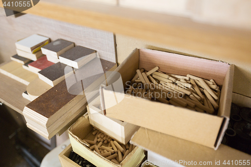 Image of wood dowel pins and board samples at workshop