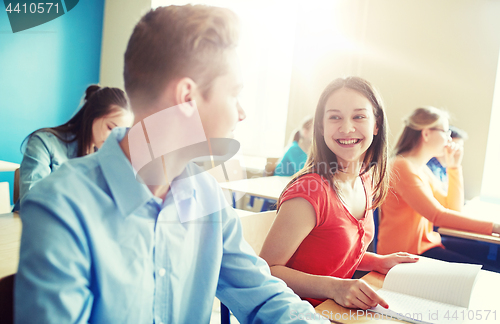 Image of group of happy students talking at school break