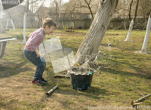 Image of  Boy playing in the garden