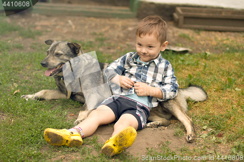 Image of Boy hugging his dog