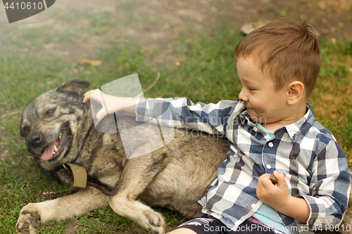 Image of Boy hugging his dog