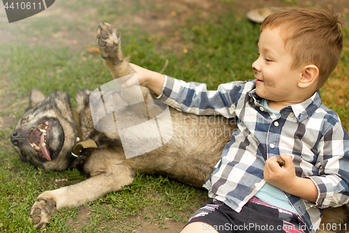 Image of Boy hugging his dog